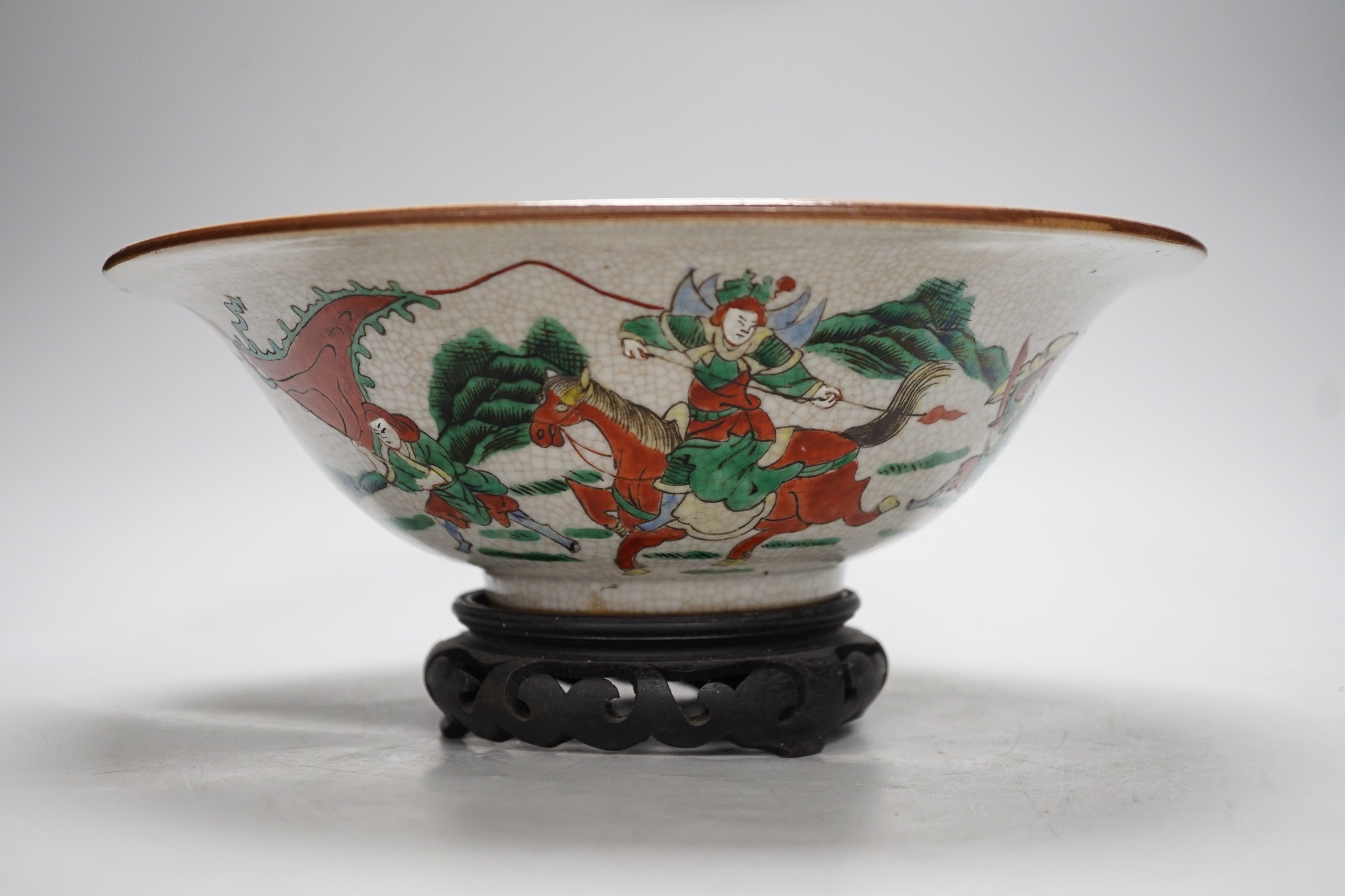 A Chinese famille verte crackle glaze ‘Eight Immortals’ bowl, early 20th century, 29cm diameter, on hardwood stand